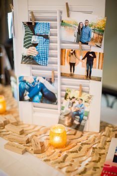 a table topped with pictures and candles