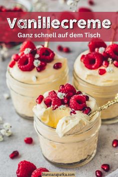 two desserts with raspberries and whipped cream in small jars on a table