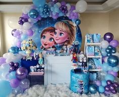 a frozen princess birthday party with balloons and decorations