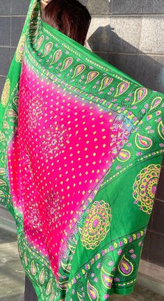 This bright pink and green shawl is beautifully decorated with golden dots and colorful peacock feather designs along the edges. It's light and can be worn in many different ways, perfect for adding a pop of color to any outfit. Great for special events or everyday wear, this shawl brings a touch of Afghan style to your look. Pink Bohemian Silk Shawl Scarf, Bohemian Silk Scarf For Festivals, Bohemian Multicolor Shawl For Diwali, Multicolor Bohemian Shawl For Diwali, Summer Multicolor Shawl Dupatta, Multicolor Summer Shawl Dupatta, Summer Multicolor Shawl-style Dupatta, Multicolor Shawl Dupatta For Summer, Pink Dupatta For Summer Festival