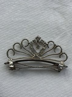 "A vintage hair clip barrette. The hair clip is made of silver-composite metal with a vintage aged silver type patina. See photos -first photo was lightened to show details.It features a pretty pattern and rhinestones. -Material(s): silver composite metal -Approximate Size: 3\" long x 1-3/4\" height -Push to release clip -Condition Vintage-good" Vintage Goblets, Vintage Hair Clips, Iron Ring, Vintage Hair, Ring Pictures, Vintage Clip, Pretty Patterns, Vintage Hairstyles, Hairstyle Ideas