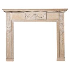 an antique fireplace mantel with carvings on the front and sides, in white marble