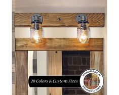 two mason jar lights are hanging from a wooden frame over a mirror with the words, 20 colors and custom sizes