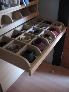 an organized drawer is shown with shoes in it