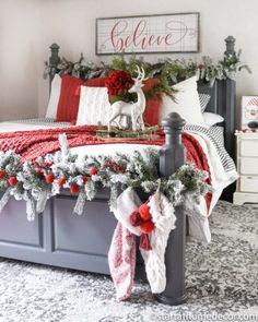 a bedroom decorated for christmas with red and white decor