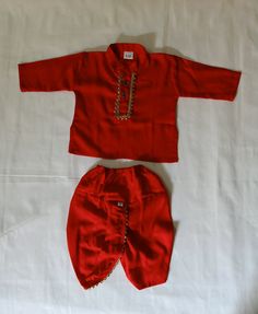 This traditional Indian Red Rayon Dhoti Kurta Dress will surely add charm to your cute boy. SALES PACKAGE - 1 Kurta, 1 Dhoti FABRIC - Rayon - Soft Cloth for baby. OTHER DETAILS - It has a soft elastic belt for convenient fitting on the waist. Delivery time ranges between 11 - 18 working days. we provide a Express Shipping Also 5-7 days with Extra charge, You may choose in shipping Option. * You May Conversation With Me if You have any doubt. Thank you so much to visit my shop. Rajesh Bansal owner of Rajasthani Dresses Boy Kurta, Traditional Dresses Indian, Suit Traditional, Kids Indian Wear, Rajasthani Dress, Boy Dress, Red Kurta, Kurta Style, Baby Boy Dress