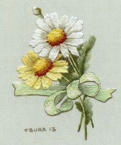 two daisies on a white background with the words tour 13 written in gold and green