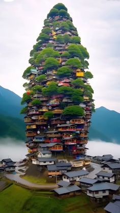 a very tall building with lots of trees on top