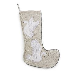 a christmas stocking with white doves on it