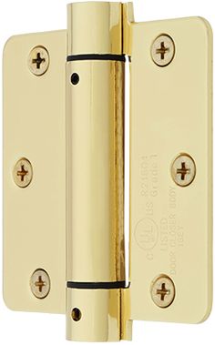 a brass plated door hinge with two screws on each side and an opening to