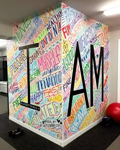 an office wall with the word iam written all over it