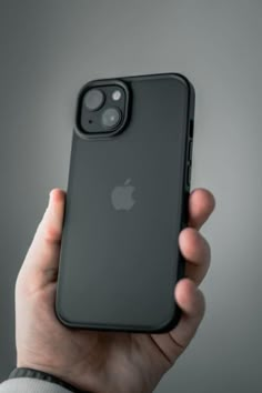 a person holding an iphone case in their hand, with the back cover partially open