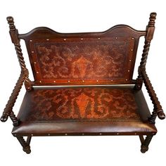 an old wooden bench with intricate carvings on it's back and seat, against a white background