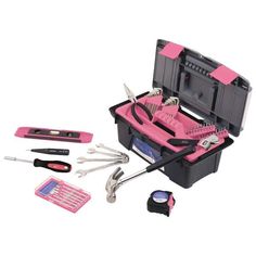 a pink tool box filled with tools on top of a white table next to other items