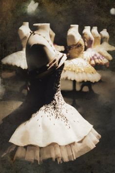 an old photo of a ballerina in front of other ballet dancers wearing tutu skirts