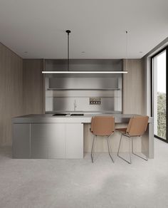 two chairs sitting in front of a kitchen counter with an oven and sink next to it