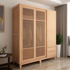 a large wooden cabinet sitting in a living room next to a window with curtains on the windowsill