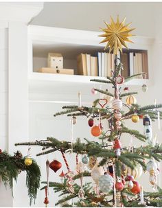 a christmas tree with ornaments hanging from it