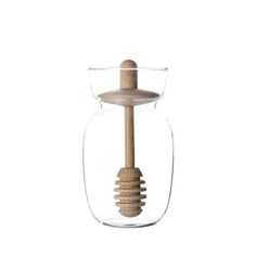 a glass jar with a wooden stick in it