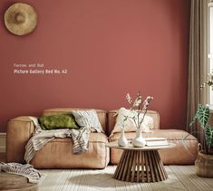 a living room with red walls and furniture