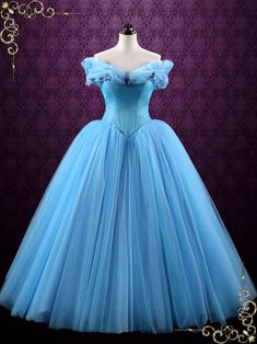 "Cinderella" is our latest creation based on the movie Cinderella 2015. You will feel like an enchanted princess in this magical ball gown, the sparkly tulle and crystal rhinestones sprinkled over the skirt will shine and glitter under lights. Can also be made in white for debutante balls and weddings. Working Time: 8-10 weeks Rush Order please inquire prior to order. Custom Designs We specialize in custom design services.If there's a dress you like and it's not on our website,you're more than w Blue Lace Wedding Dress, Enchanted Princess, Cinderella Blue, Blue Ball Gown, Boho Style Wedding Dress, Cinderella 2015, Blue Ball Gowns, Wedding Dresses Cinderella, Disney Princess Dresses