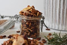 a jar filled with granola sitting on top of a table