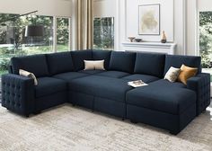 a living room with a blue sectional couch and pillows on the bottom right hand corner