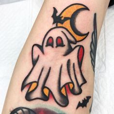 a person with a ghost tattoo on their arm