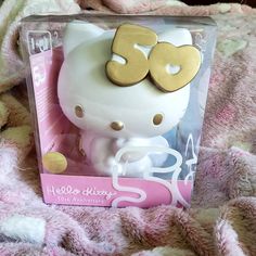 the hello kitty doll is in its box