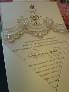 a wedding card with an ornate design on it