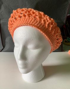 I hand crochet this lacey beret to be lightweight. Not just for winter, an open weave transitions the seasons. Wear as a fashion statement with a boho vibe. The Apricot orange color acrylic yarn is machine washable. 20" band fits most adults. Orange Crochet Hat For Spring, Handmade Orange Crochet Hat One Size, Handmade One Size Orange Crochet Hat, Spring Handmade Crochet Beanie, Hand Knitted Crochet Hat For Spring, One Size, Hand Knitted Spring Hats, Hand Knitted Crochet Hat For Spring, Hand-knitted Crochet Hat For Spring, Hand-knitted Spring Crochet Hat