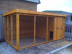 a small wooden structure sitting in the middle of a yard