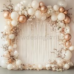 a white and gold balloon arch with flowers on the bottom, balloons in the middle