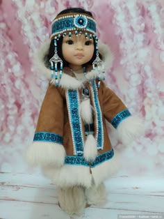 a doll dressed in native american clothing