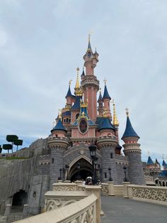 the entrance to sleeping beauty castle at disneyland world