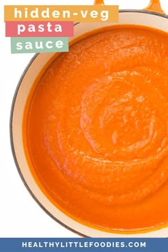 an orange sauce in a white bowl with the words hidden - veg pasta sauce