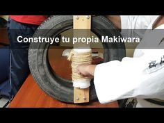 a person holding a tire with rope attached to it and the words construye tu propia makiwara