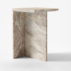 a marble table with an open corner on the top and one section showing it's surface