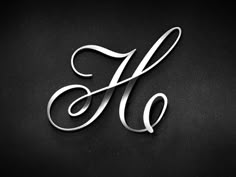 the letter h made out of metal on a black background