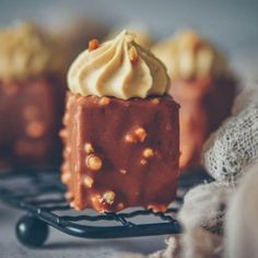 three pieces of cake sitting on top of a wire rack