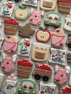 many decorated cookies are displayed on a table