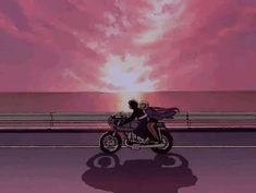 two people riding on a motorcycle in front of the ocean at sunset, with pink clouds