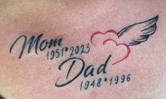 the back of a woman's stomach with a heart and wings tattoo on it