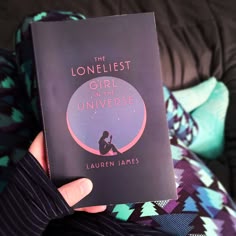 the lonelist girl in the universe by lauren james is held up to the camera