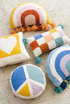 colorful pillows and cushions on the floor