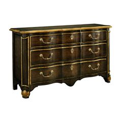 an old fashioned dresser with gold trimmings on the top and bottom drawers,