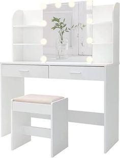 a white vanity with lights on it and a stool