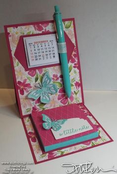 a card with a pen and calendar on it