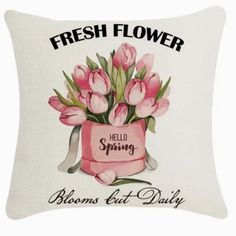 a white pillow with pink tulips on it and the words, fresh flower