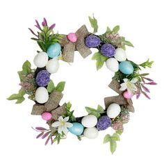 an easter wreath with eggs, flowers and leaves